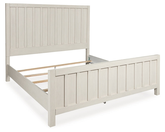 Shaybrock Queen Panel Bed with Mirrored Dresser and Chest