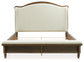 Sturlayne California King Upholstered Panel Bed with Mirrored Dresser and Chest